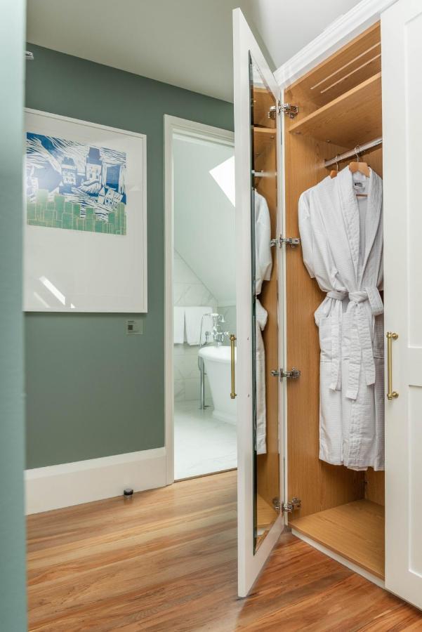 The Observatory Hotel Christchurch Exterior photo A bathrobe hanging on a door